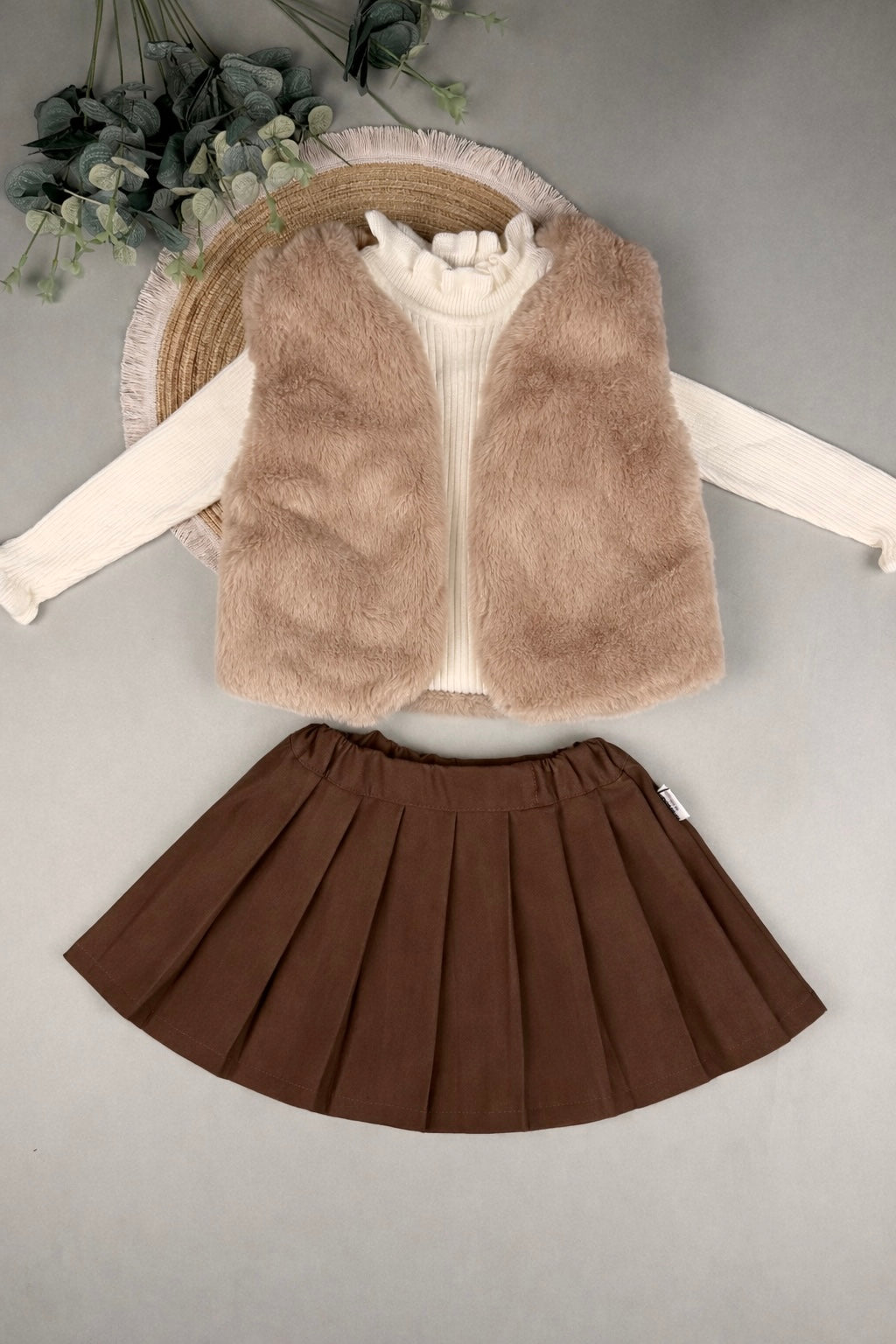 Fur vest with fleece top and corduroy skirt
