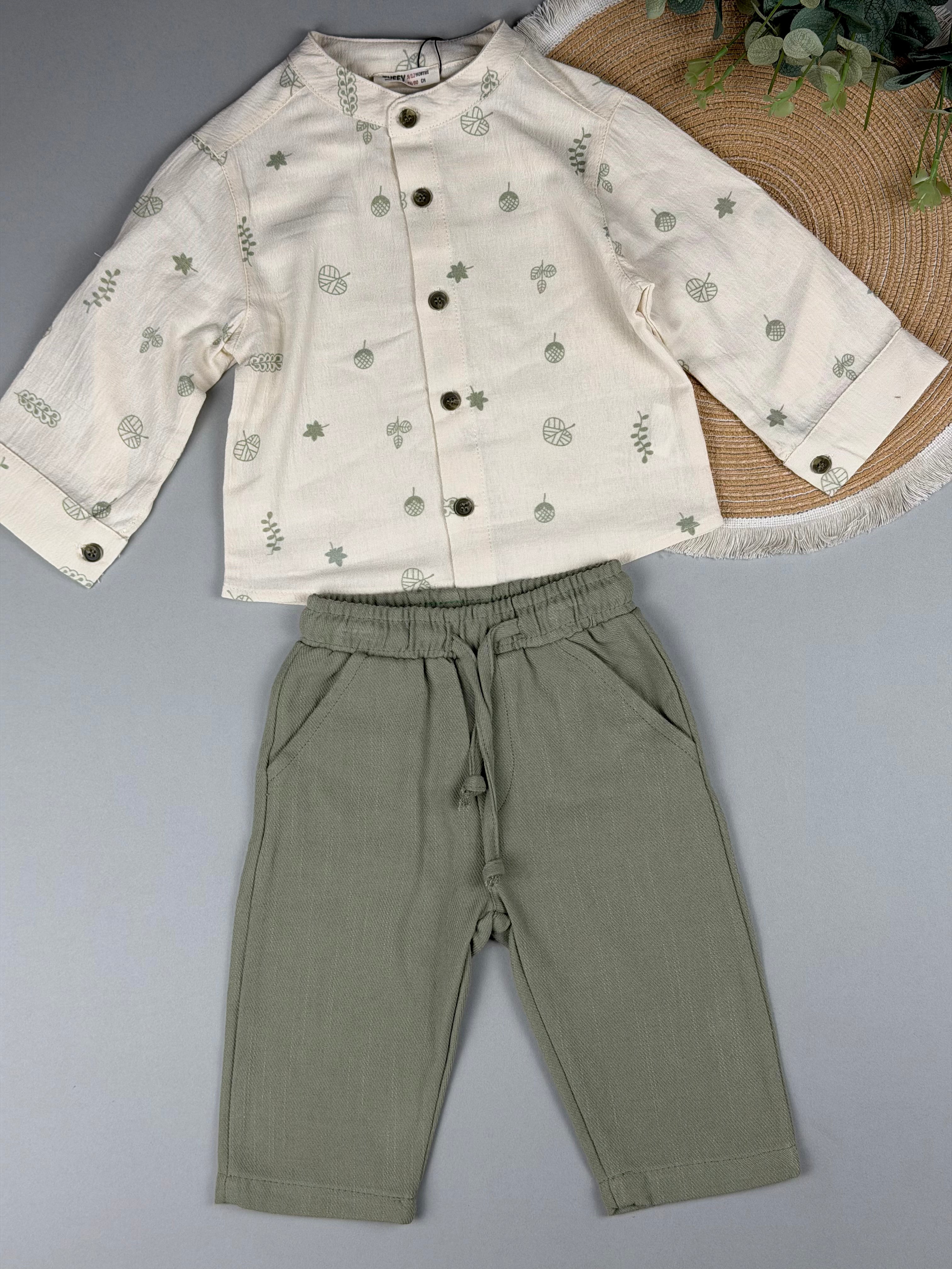 Children's outfit with a white shirt and amry green pants